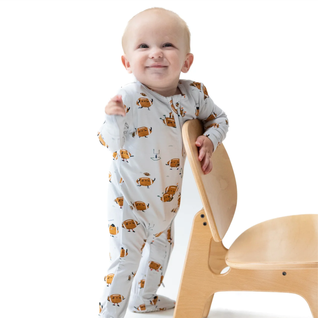 Footballs Playing Football Zipper Sleeper - Little Kinfolk Boutique | Children's Clothing Regina, SK